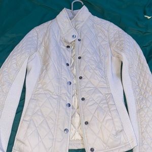 tan jacket with zipper, buttons and pockets, hourglass effect, warm and stretchy